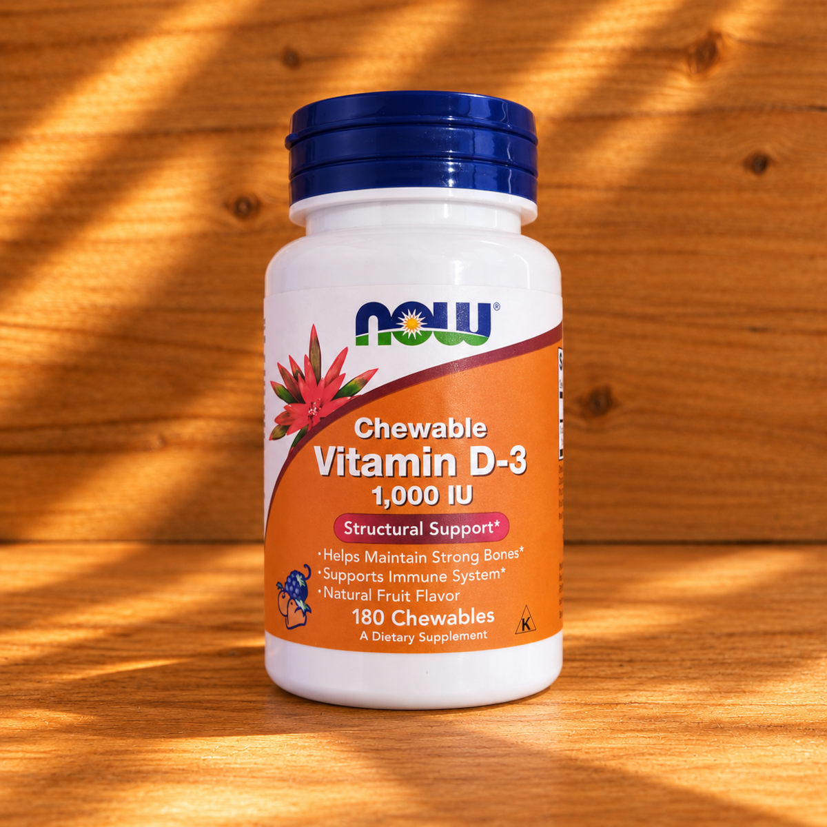 NOW Vitamin D-3 Supplement Bottle on Wood